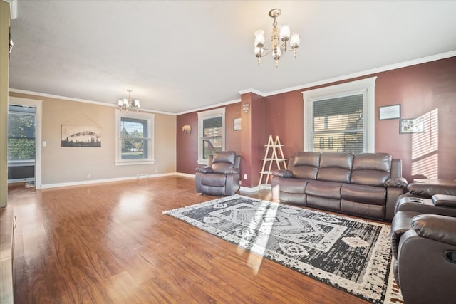 living room featuring hardwood / wood-style floors, a notable chandelier, and plenty of natural light