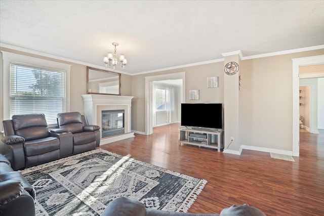 living room with ornamental molding, a chandelier, and hardwood / wood-style floors