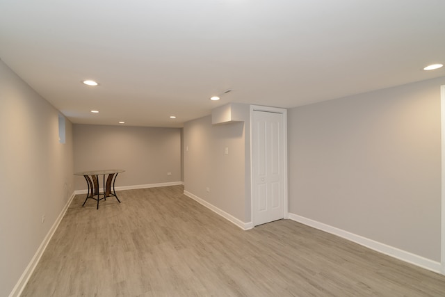 basement featuring light wood-type flooring