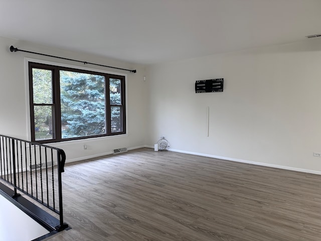 unfurnished room featuring hardwood / wood-style floors