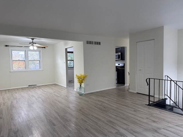 spare room featuring ceiling fan and wood-type flooring