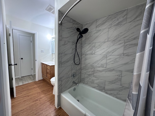 full bathroom with toilet, vanity, shower / bath combo, and wood-type flooring