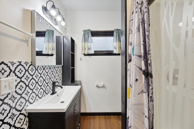 bathroom with vanity, hardwood / wood-style floors, and plenty of natural light