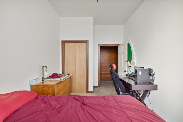 bedroom featuring light carpet