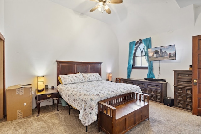 bedroom featuring lofted ceiling, light carpet, and ceiling fan