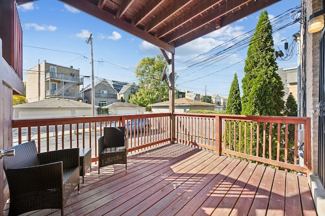 wooden terrace featuring a garage