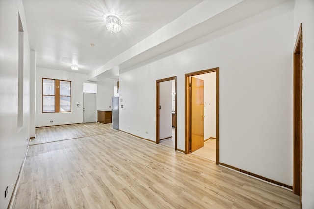 unfurnished living room with light wood-type flooring