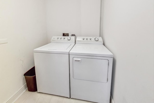 washroom featuring washing machine and dryer