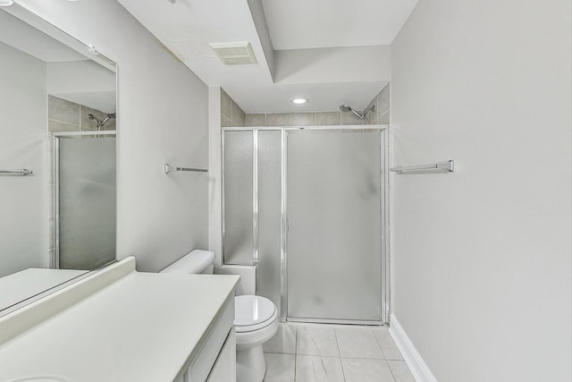 bathroom with vanity, toilet, and a shower with door