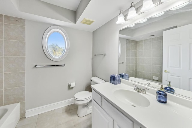 bathroom featuring vanity, toilet, and tile patterned floors