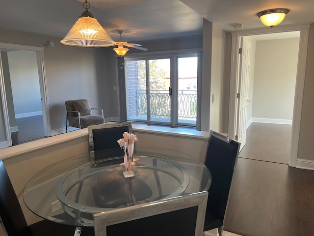 dining space featuring ceiling fan