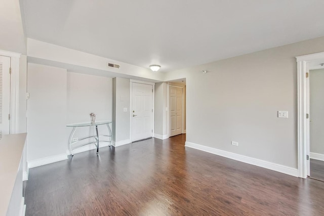 empty room featuring dark hardwood / wood-style floors