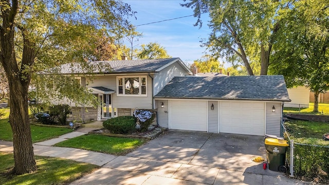 view of front of house with a garage and a front lawn