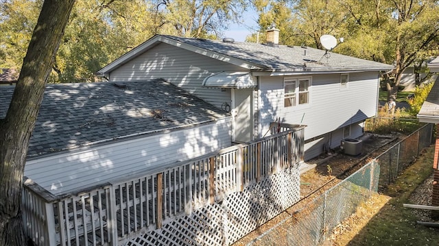 view of front facade with a wooden deck and cooling unit