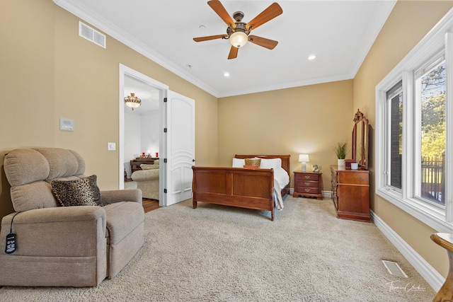 bedroom with crown molding, ceiling fan, and light colored carpet