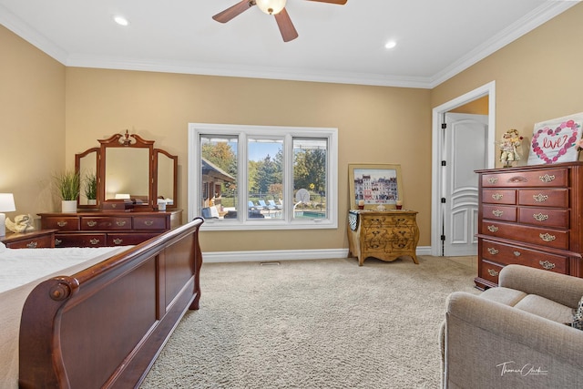 carpeted bedroom featuring ornamental molding and ceiling fan