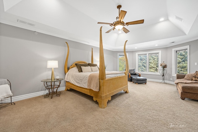 bedroom featuring crown molding, carpet, ceiling fan, and a tray ceiling