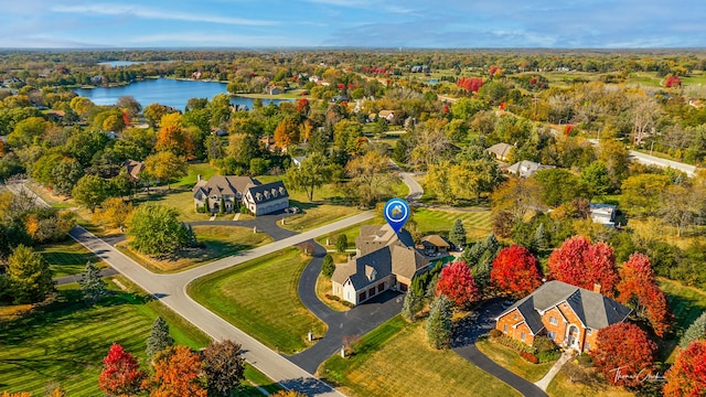 drone / aerial view with a water view