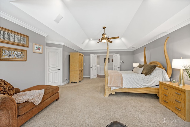 carpeted bedroom featuring ceiling fan, ornamental molding, and vaulted ceiling