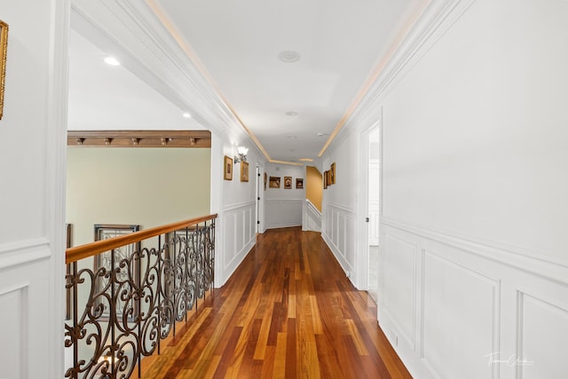 hallway with crown molding and dark wood-type flooring