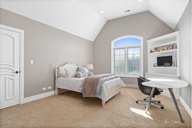 carpeted bedroom with vaulted ceiling