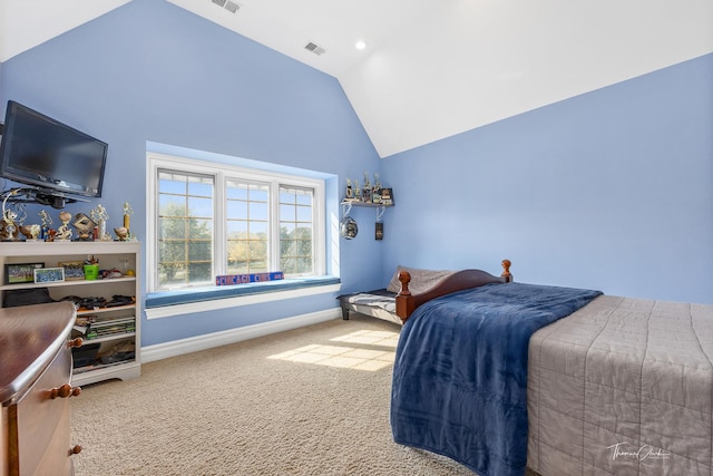 bedroom featuring vaulted ceiling and carpet flooring