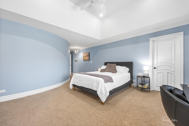 bedroom with vaulted ceiling and carpet