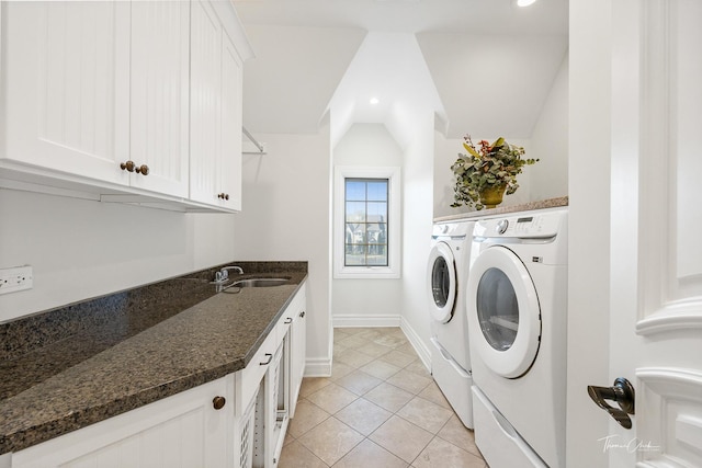 laundry room with cabinets, sink, light tile patterned floors, and independent washer and dryer