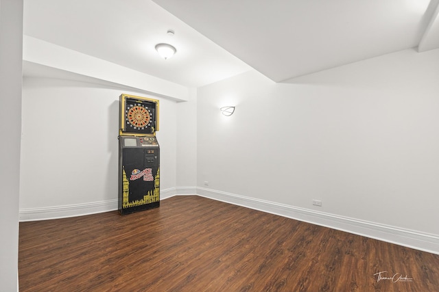 spare room with dark hardwood / wood-style flooring