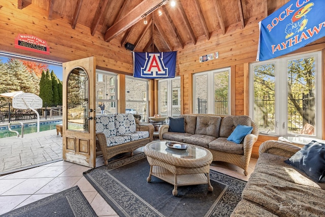 sunroom / solarium with wood ceiling, rail lighting, and vaulted ceiling with beams