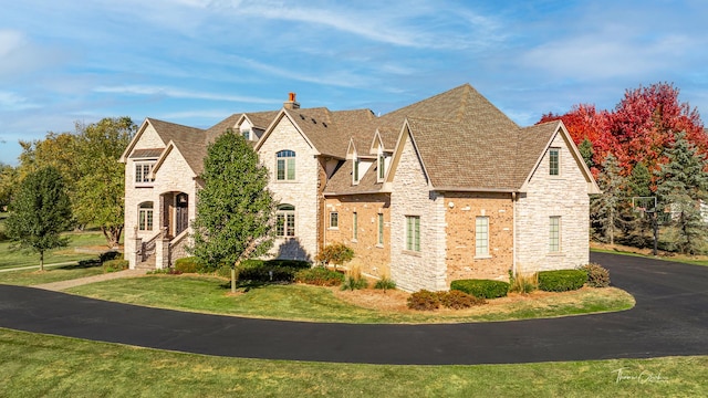 view of front of home with a front lawn