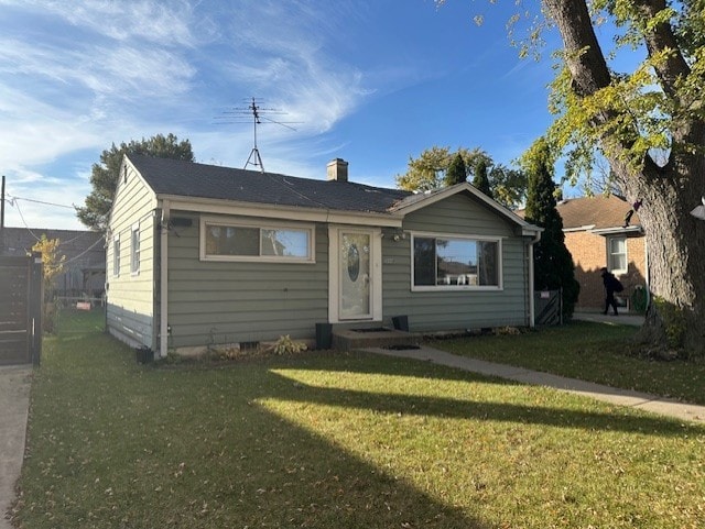 bungalow-style house with a front yard