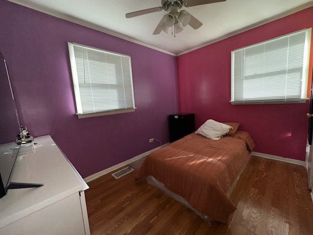 bedroom featuring ceiling fan and hardwood / wood-style flooring