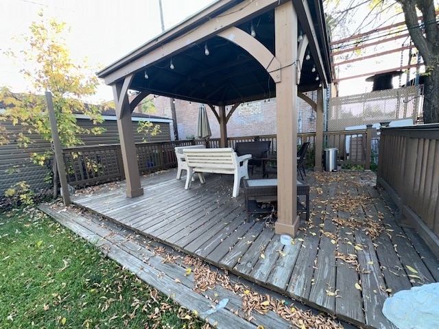 wooden deck featuring a gazebo