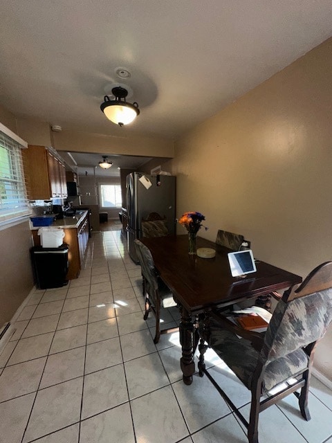 dining area with light tile patterned floors