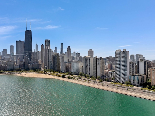 property's view of city with a water view