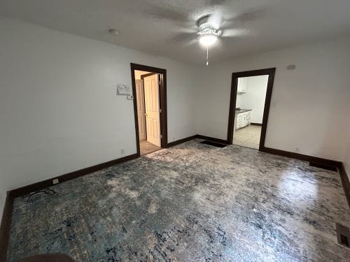 unfurnished room featuring ceiling fan