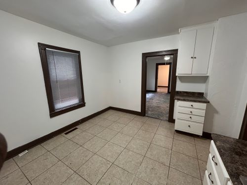 empty room with light tile patterned floors