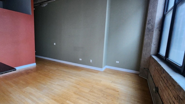 unfurnished room with light hardwood / wood-style floors