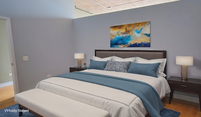 bedroom featuring hardwood / wood-style flooring