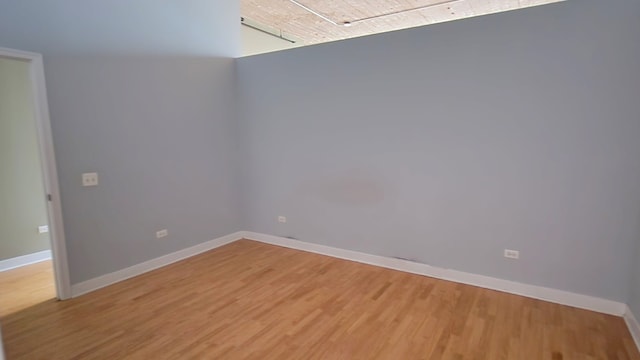 empty room with wood-type flooring