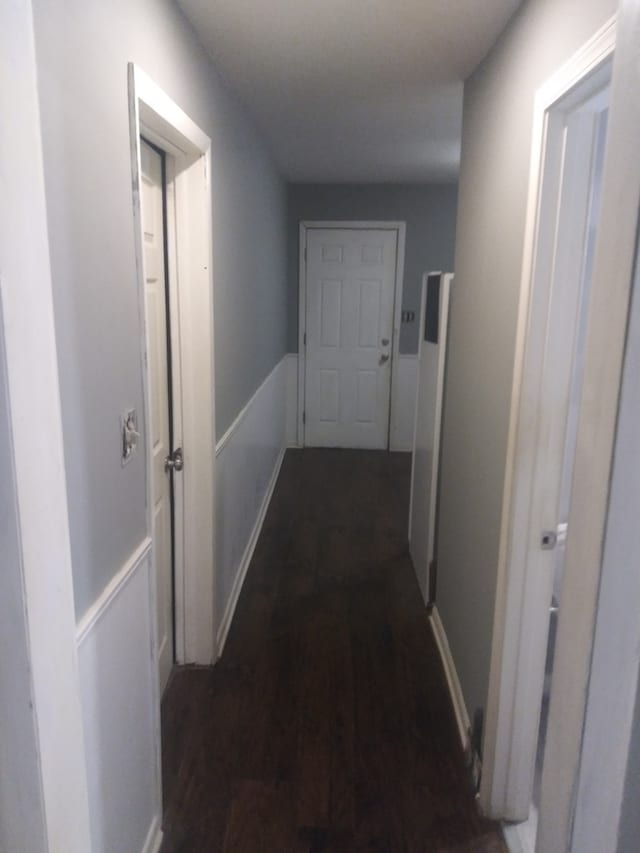 hallway featuring dark wood-type flooring