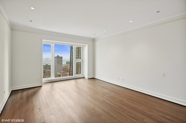 77 E Walton St Unit 28B, Chicago, IL 60611 - spare room featuring crown molding, wood finished floors, and baseboards