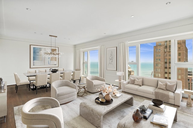 77 E Walton St Unit 28B, Chicago, IL 60611 - living area with a water view, ornamental molding, a chandelier, and wood finished floors