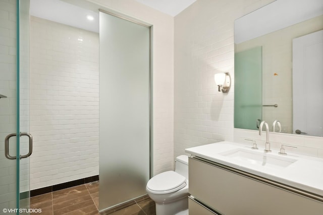77 E Walton St Unit 28B, Chicago, IL 60611 - bathroom with toilet, a shower stall, and vanity