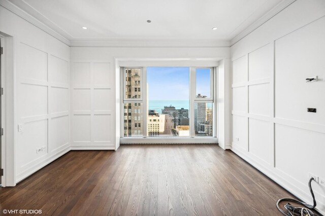 77 E Walton St Unit 28B, Chicago, IL 60611 - empty room with a decorative wall, ornamental molding, and dark wood-style floors