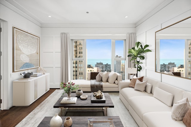 living room featuring ornamental molding, dark hardwood / wood-style flooring, and a water view