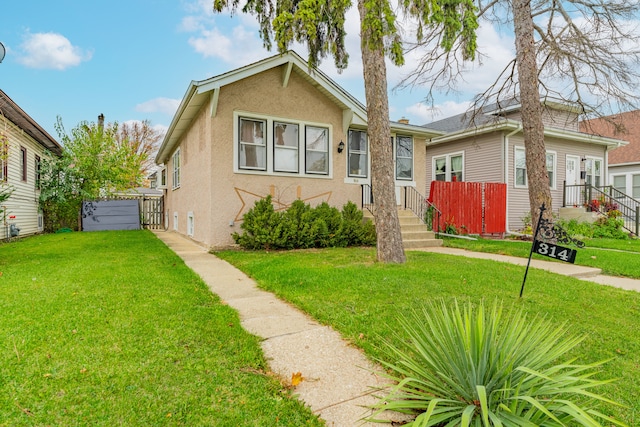 bungalow-style house featuring a front yard