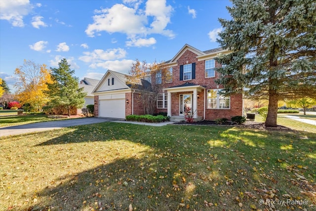 view of front of property with a front yard and a garage