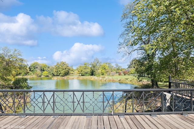 wooden deck featuring a water view